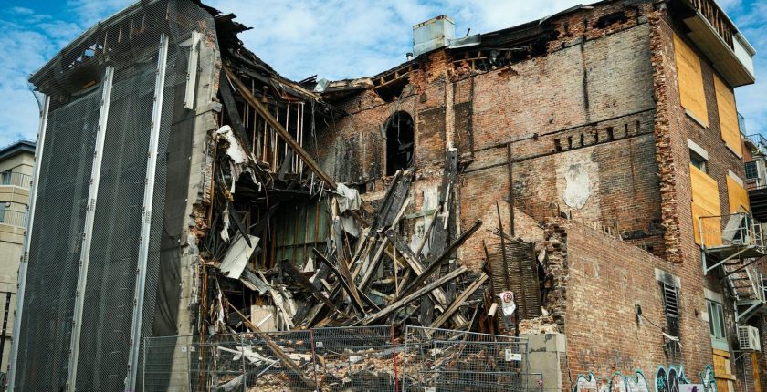 Scene of a partially demolished brick building in Montreal, showcasing urban decay and redevelopment.