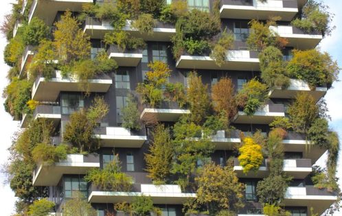 Bosco Verticale in Milan showcasing innovative eco-friendly design with lush greenery on a skyscraper.